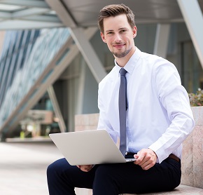 Businessman use of the laptop computer at outdoor