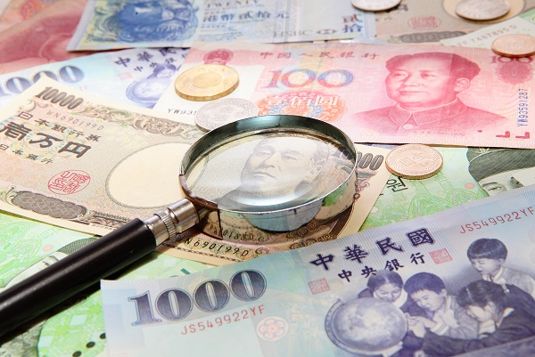 asian currency and magnifying glass (include Korean Won, Taiwan dollar, Chinese Money yuan , Hong Kong Dollar, japanese Yen)